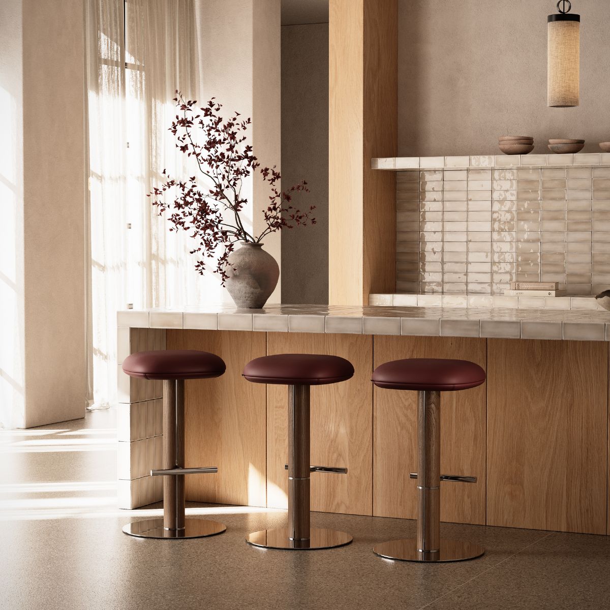 Kitchen with Hiro Bar Chairs by Domkapa A kitchen scene featuring three bar chairs and a vase, highlighting a cosy dining area.