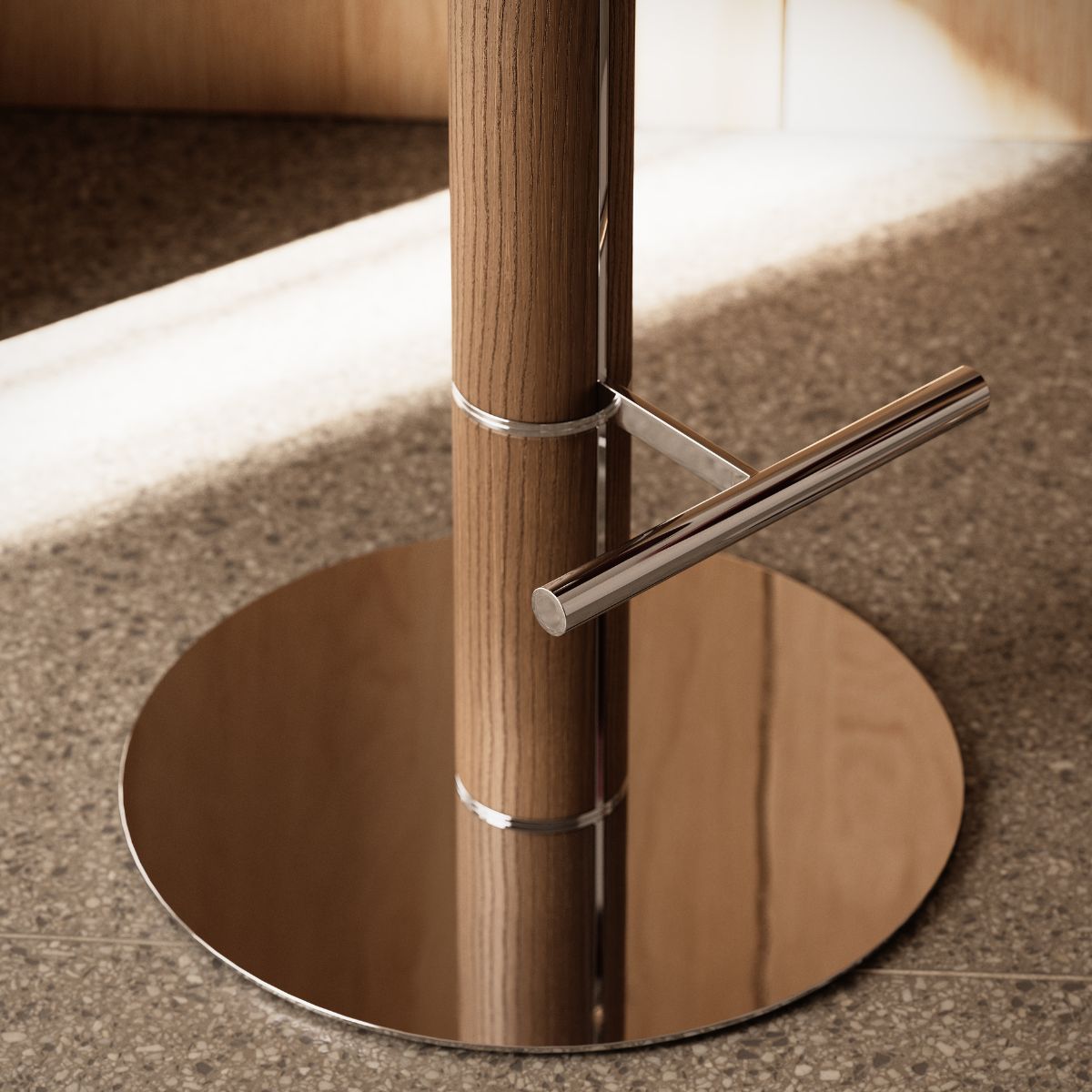 Hiro bar chair by Domkapa A wooden stool featuring a metal pole on top, combining natural and industrial elements in its design.