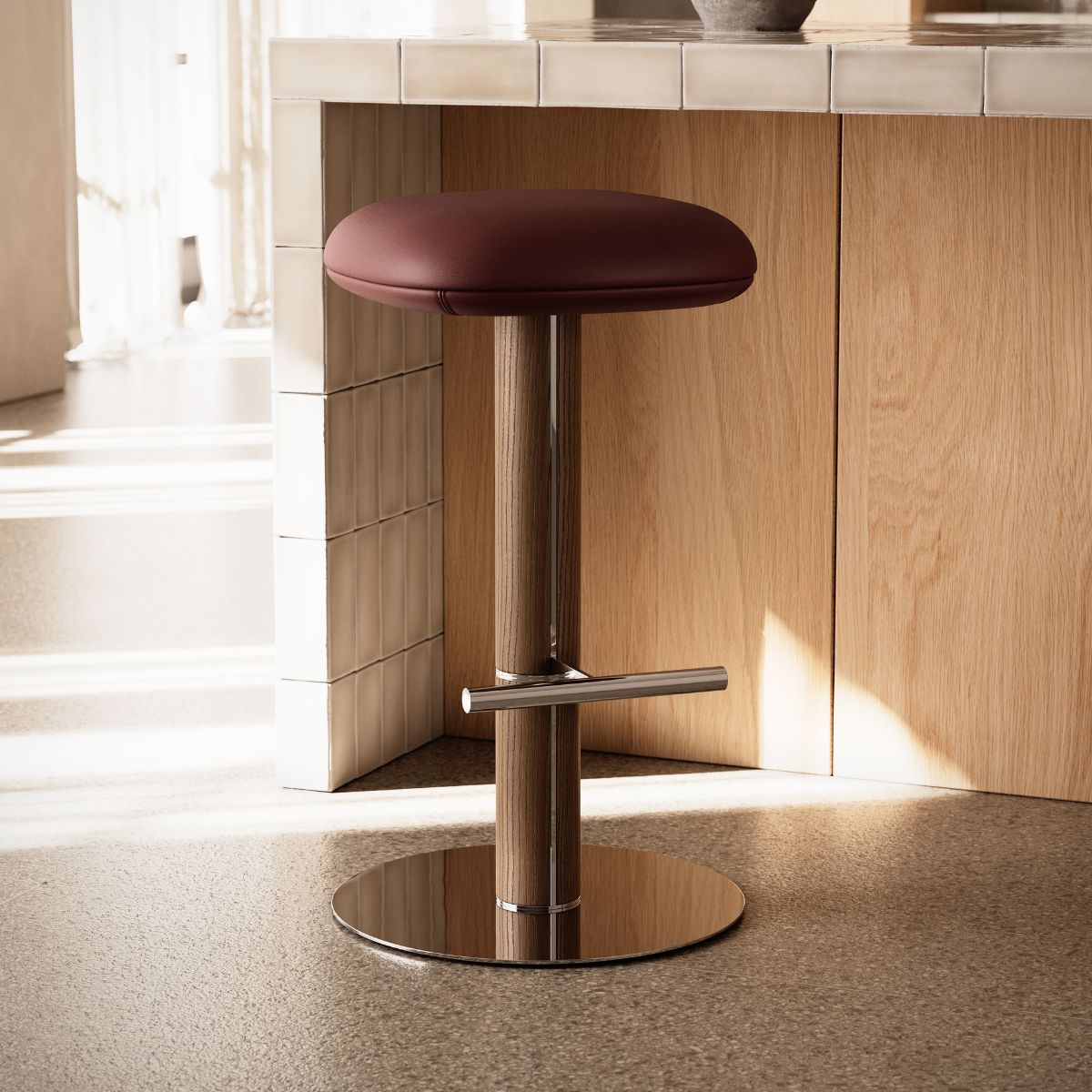 Hiro bar chair by Domkapa A modern bar chair featuring a vibrant red seat, designed for contemporary interiors.