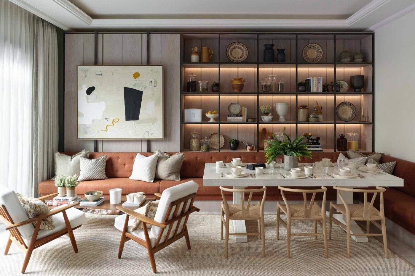 Albion Nord (1) Living room and dining room project by Albion Nord. With neutral and earthy tones and wood accents in the chairs.