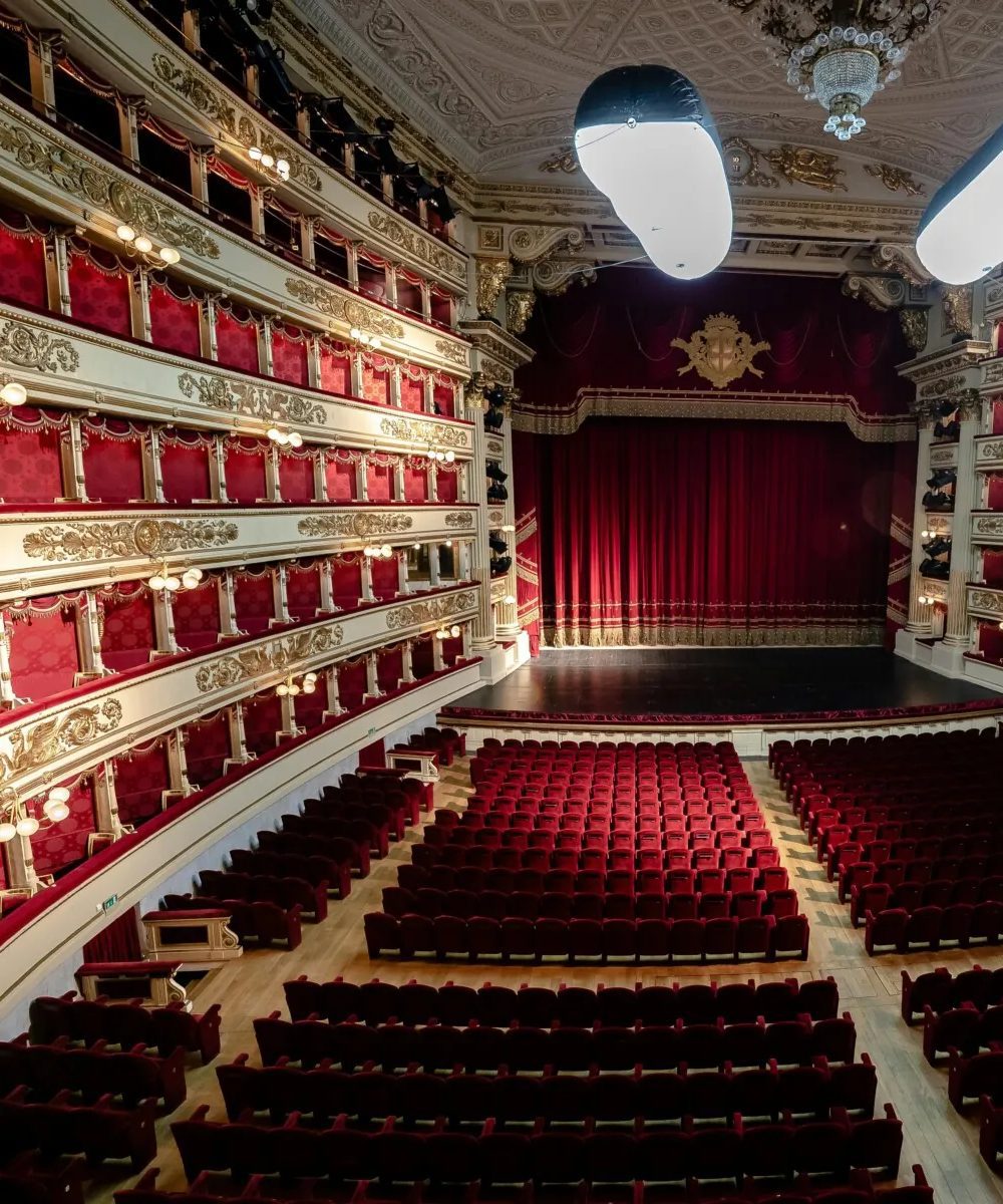 Alla Scala Theatre Inside Alla Scala Theatre, red seats are visible, creating a warm and inviting atmosphere.