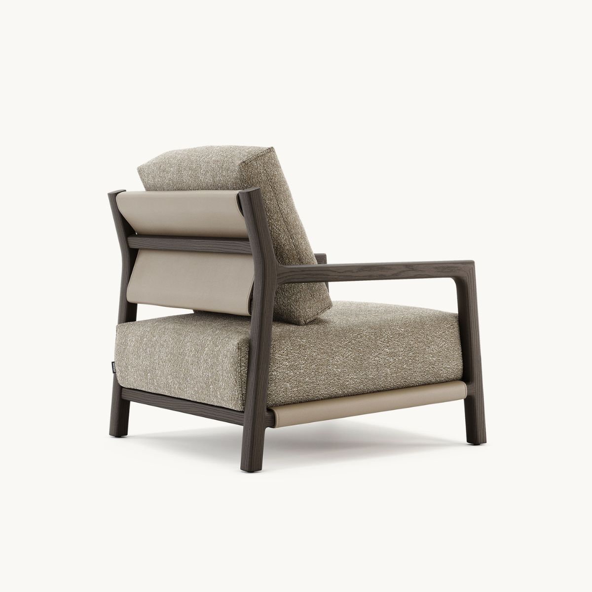 Alton armchair by Domkapa with a brown upholstered seat, designed for comfort and style.