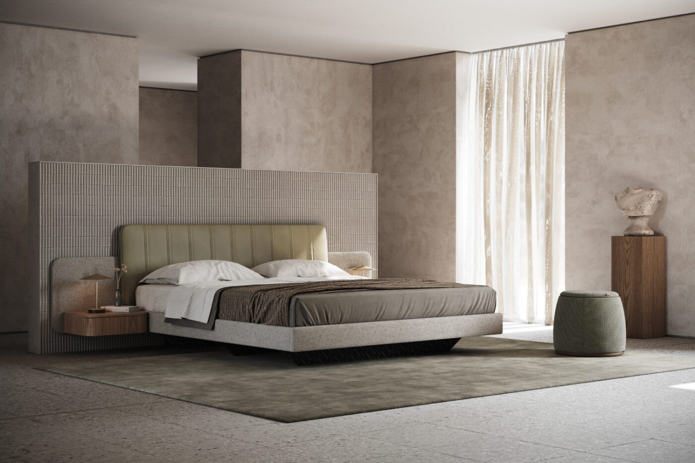 Amanda Bed & Avery Pouf Bedroom with a bed with leather and upholstered headboard and two wooden bedside tables. With an upholstered pouf that can also be used as extra storage. The tones are autumnal green and neutrals.