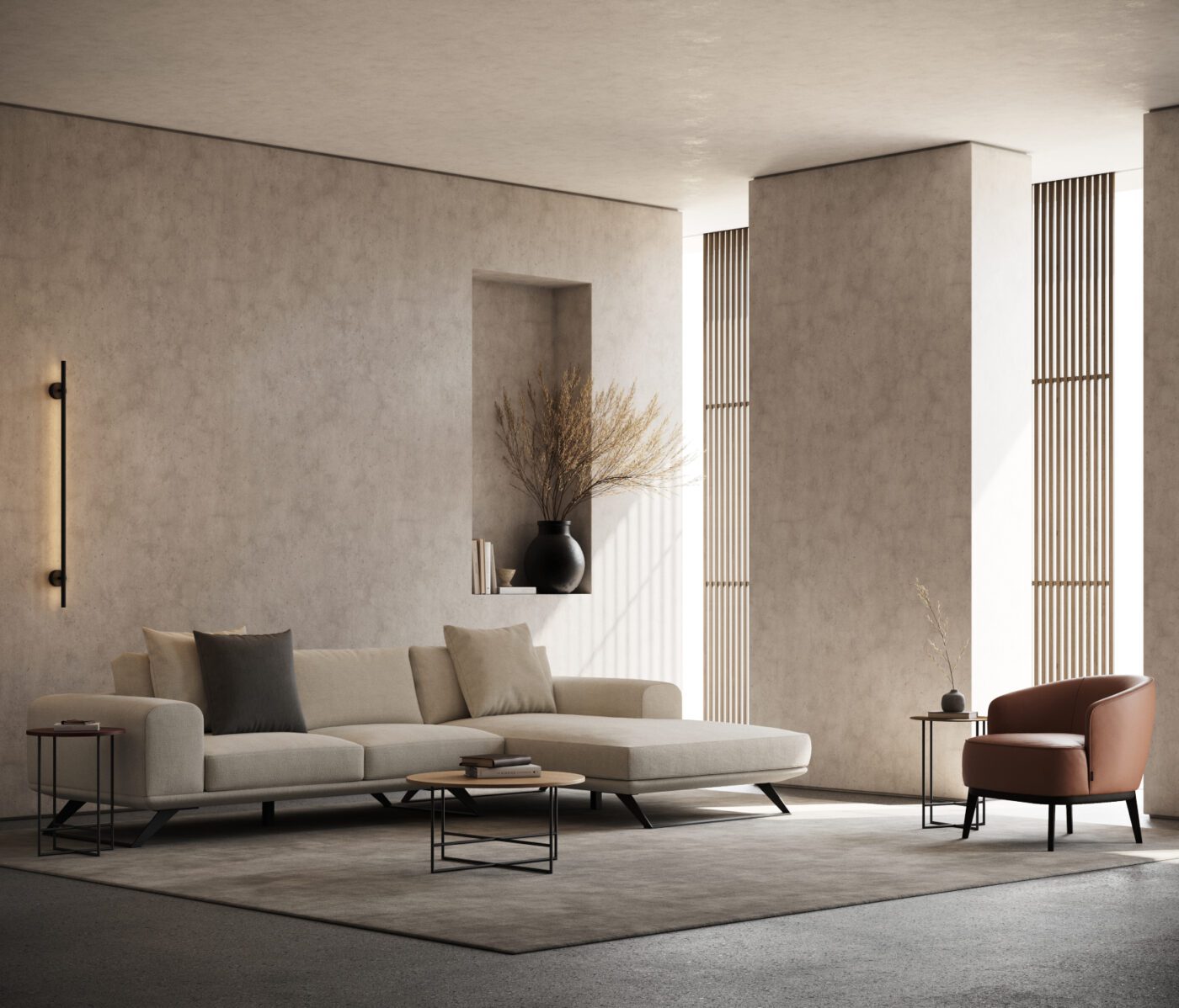 Aniston sofa and Megan Armchair A contemporary living room featuring a stylish beige sofa, an elegant armchair in leather and a sleek lamp, creating a cosy atmosphere.