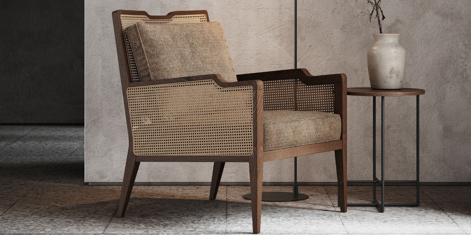 An armchair in wood and rattan and a table set before a wall, illustrating a straightforward and functional interior design.