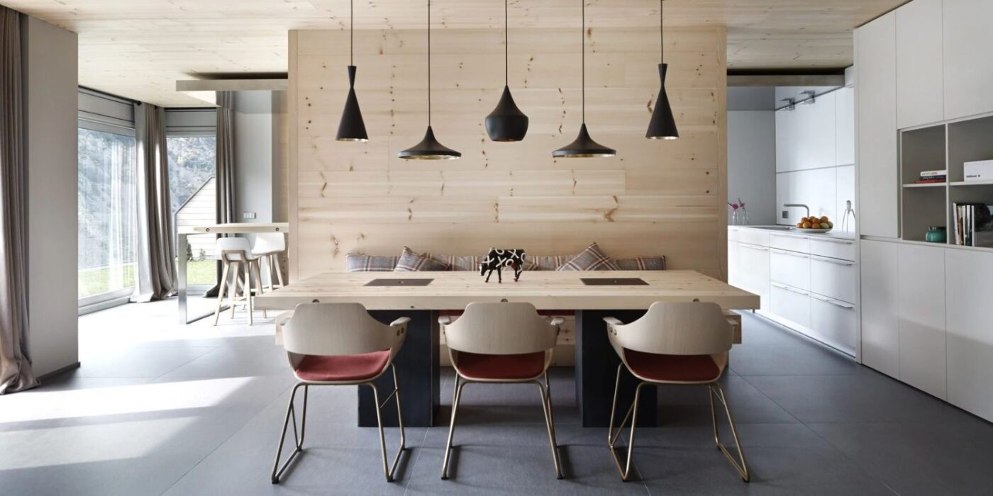 Blog Featured Image - 2026-04-09T155838.842 Stylish kitchen showcasing wooden walls and a modern table, blending elegance with a welcoming ambience.