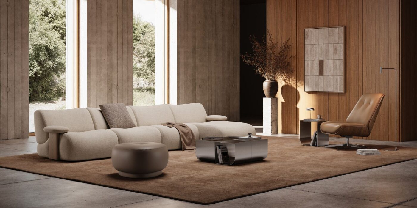 A modern living room showcasing a couch, a chair, and an ottoman, designed for comfort and aesthetic appeal.