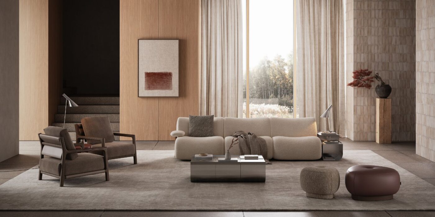 Blog Featured Image - 2026-04-21T174441.722 A modern living room showcasing a sofa, an armchair, a pouf and a table, designed for comfort and social interaction.