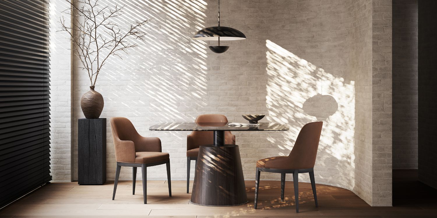 A minimalist dining room featuring a stylish table surrounded by elegant chairs, showcasing modern design elements.