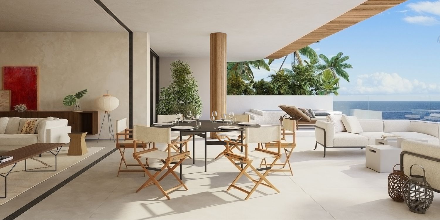 A modern living room designed with ocean views, highlighting large windows and elegant decor. From one of the best italian interior designers.