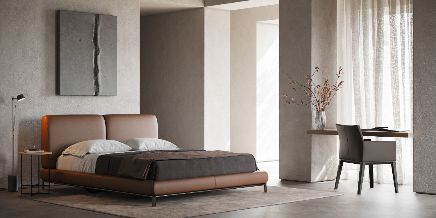 A contemporary bedroom showcasing a bed, a sleek desk, and a chair, designed for comfort and productivity.