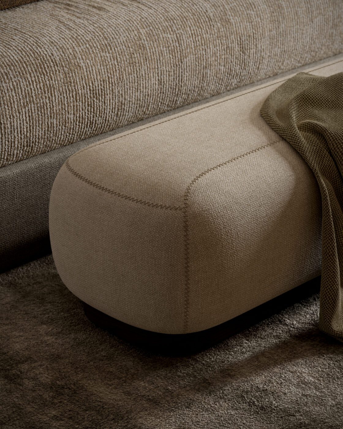 Claire bench stitching details The comfortable Claire Bench featuring a warm blanket draped over it, perfect for lounging.