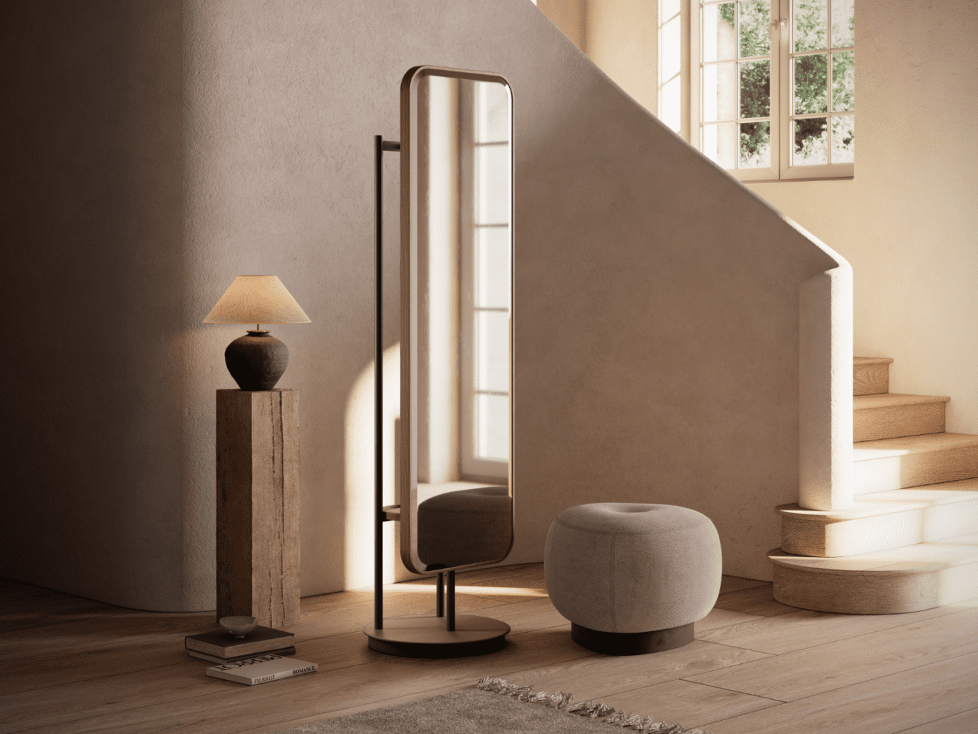 Elise Mirror and Jules Pouf by Domkapa A mirror, a wooden and upholstered pouf, and a stylish lamp arranged in a cosy room setting.