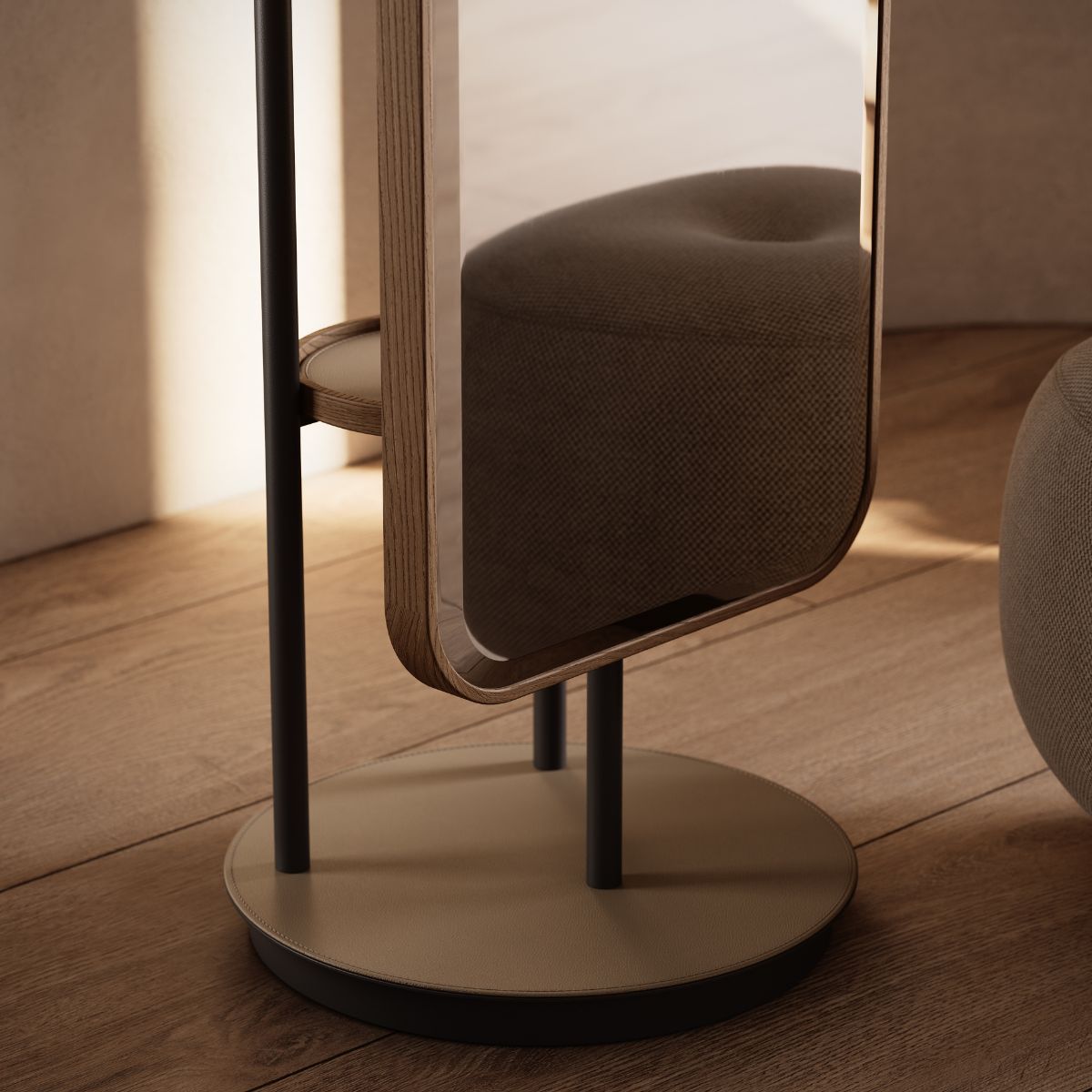 Elise Mirror by Domkapa (1) A full-length mirror on a stand placed in front of a pouf, creating a stylish setup.
