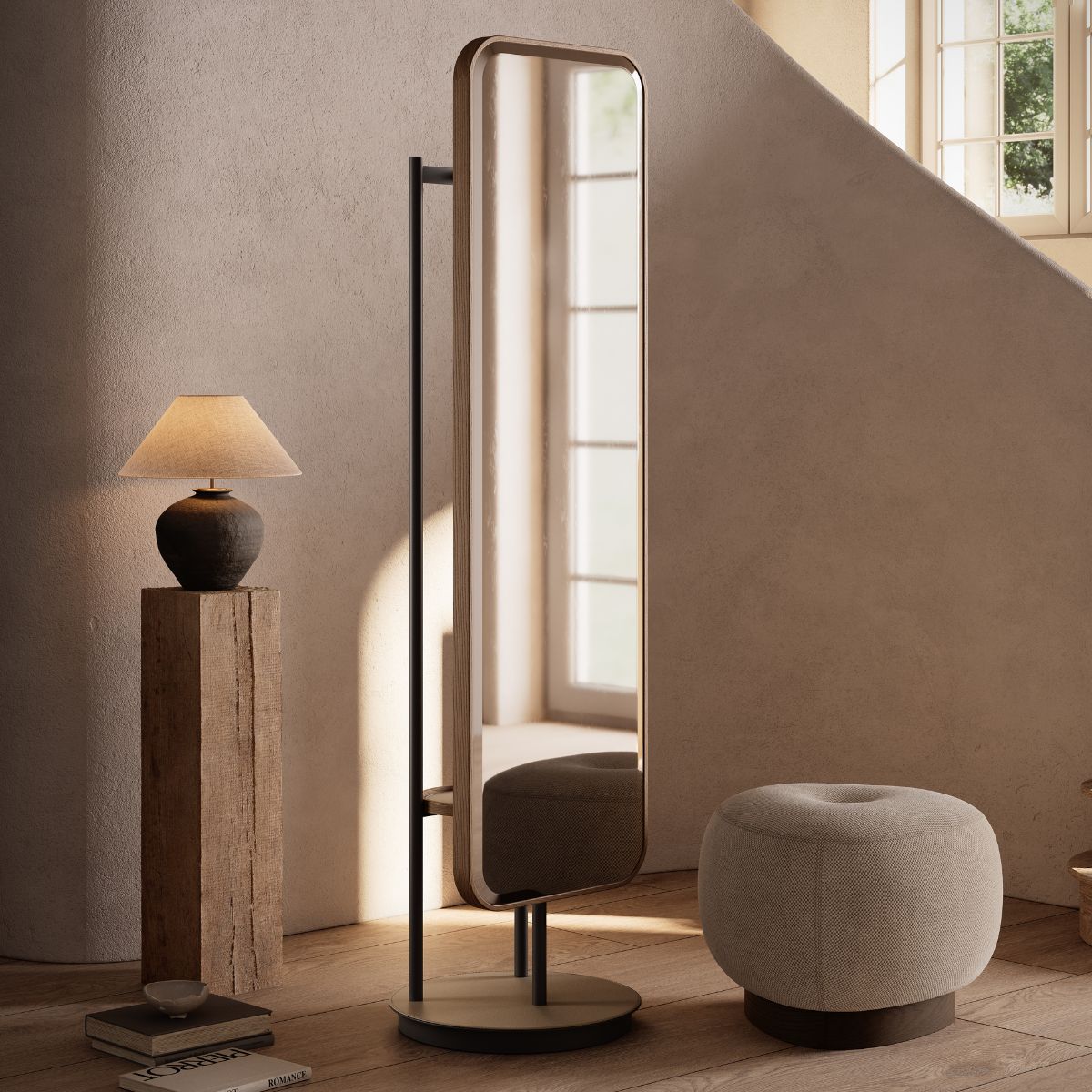 Elise Mirror by Domkapa In a room, a mirror and a stool are placed near a staircase, creating a cosy atmosphere.
