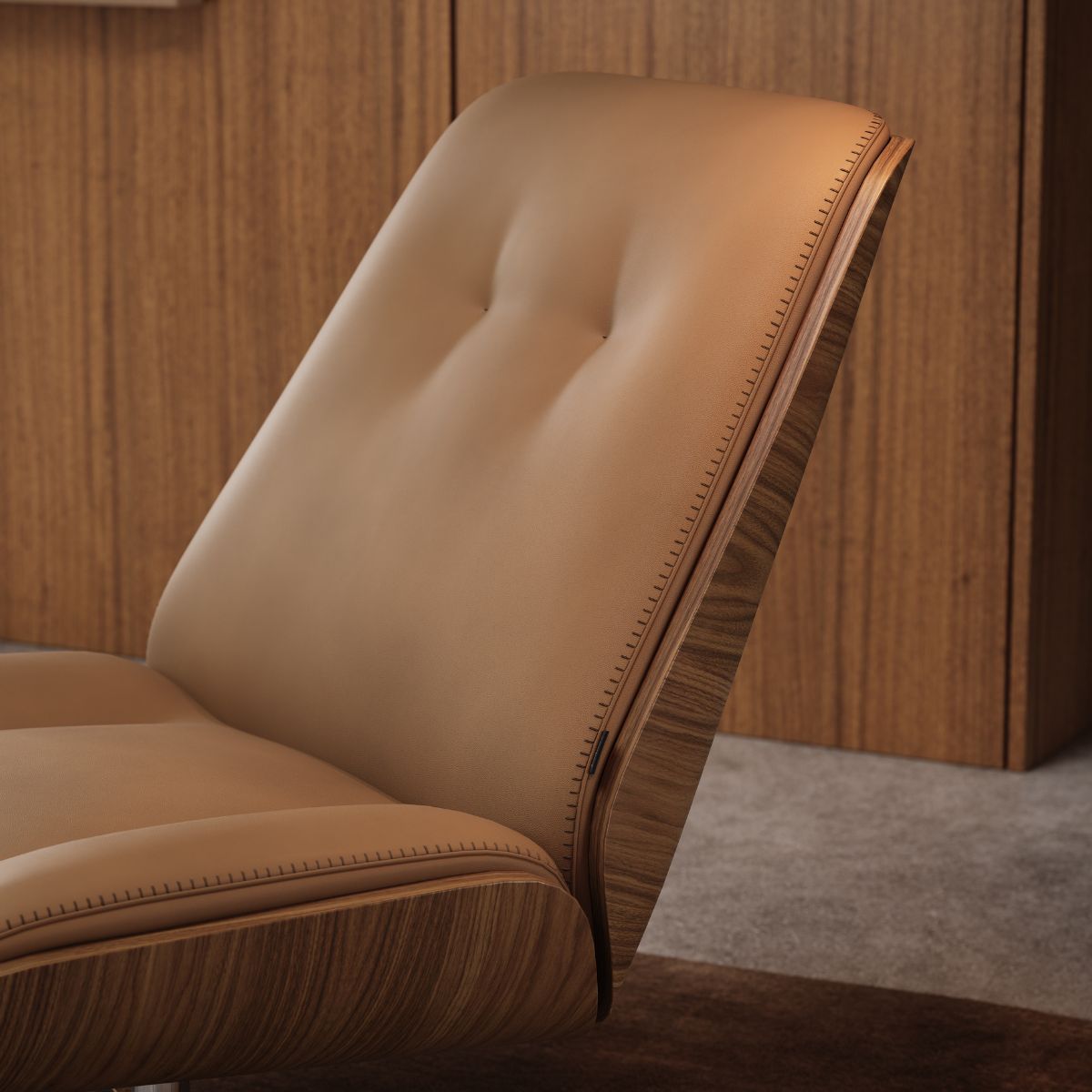 Elliot Armchair by Domkapa (4) Elliot Armchair with a brown leather seat, emphasising comfort and style in its elegant upholstery.