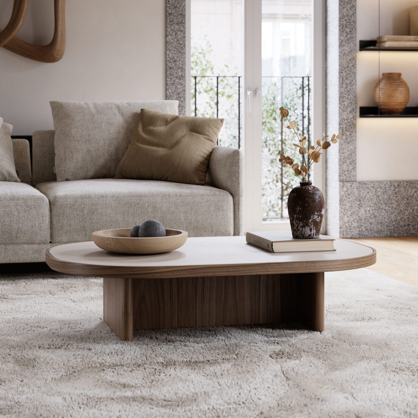 Gilbert coffee table living room A cosy white rug situated on the floor, contributing a touch of comfort and sophistication to the interior design. On top of it is a coffee table with customisable top, which perfectly matches the 2025 interior design trends.