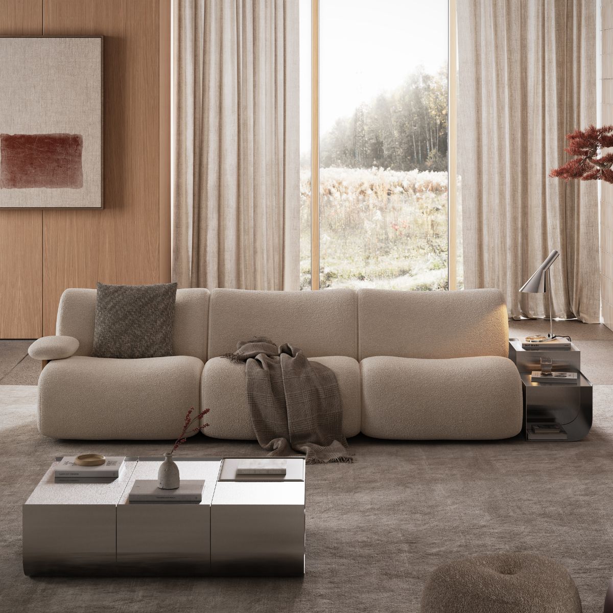 A cosy living room featuring a modular sofa, coffee table, and a large window letting in natural light.