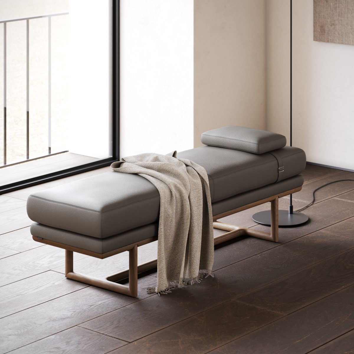 Henry bench and danish interior design A comfortable bench topped with a blanket, situated on a beautiful wooden floor.