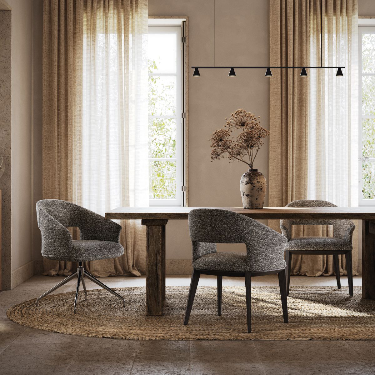 Jermain Bar Chair by Domkapa (5) Cosy dining room with a rustic wooden table, grey upholstered chairs, and a ceramic vase on a woven rug. Warm light filters through beige curtains.