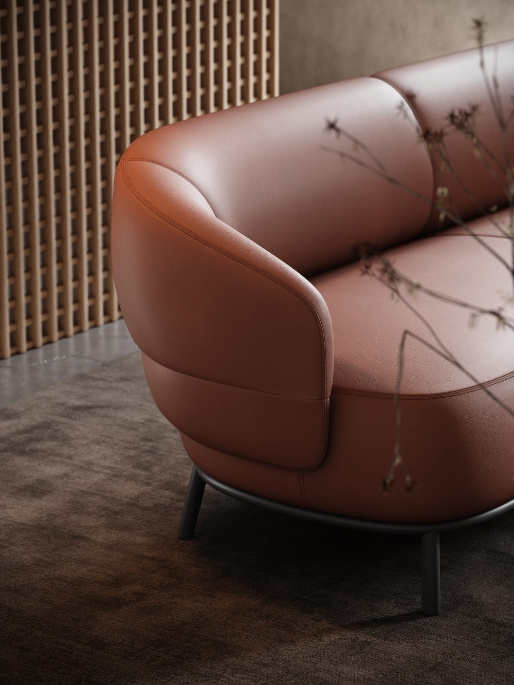 Juliet sofa and lighting A contemporary sofa showcasing a smooth brown leather seat, designed for comfort and modern aesthetics. One of the statement pieces of the living room.