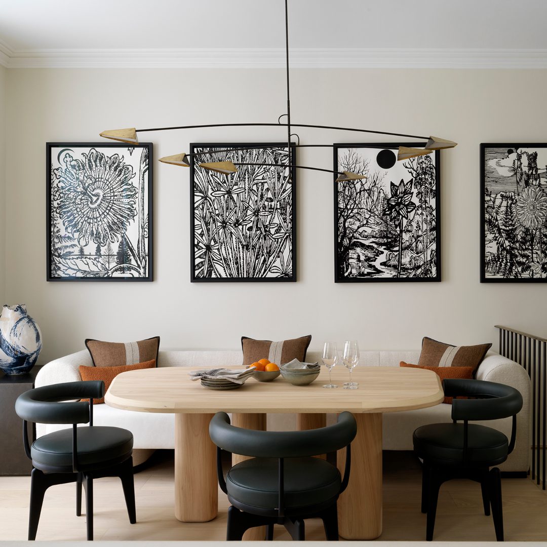 K&H Design K&H dining room project with wood tones and dark dining chairs.