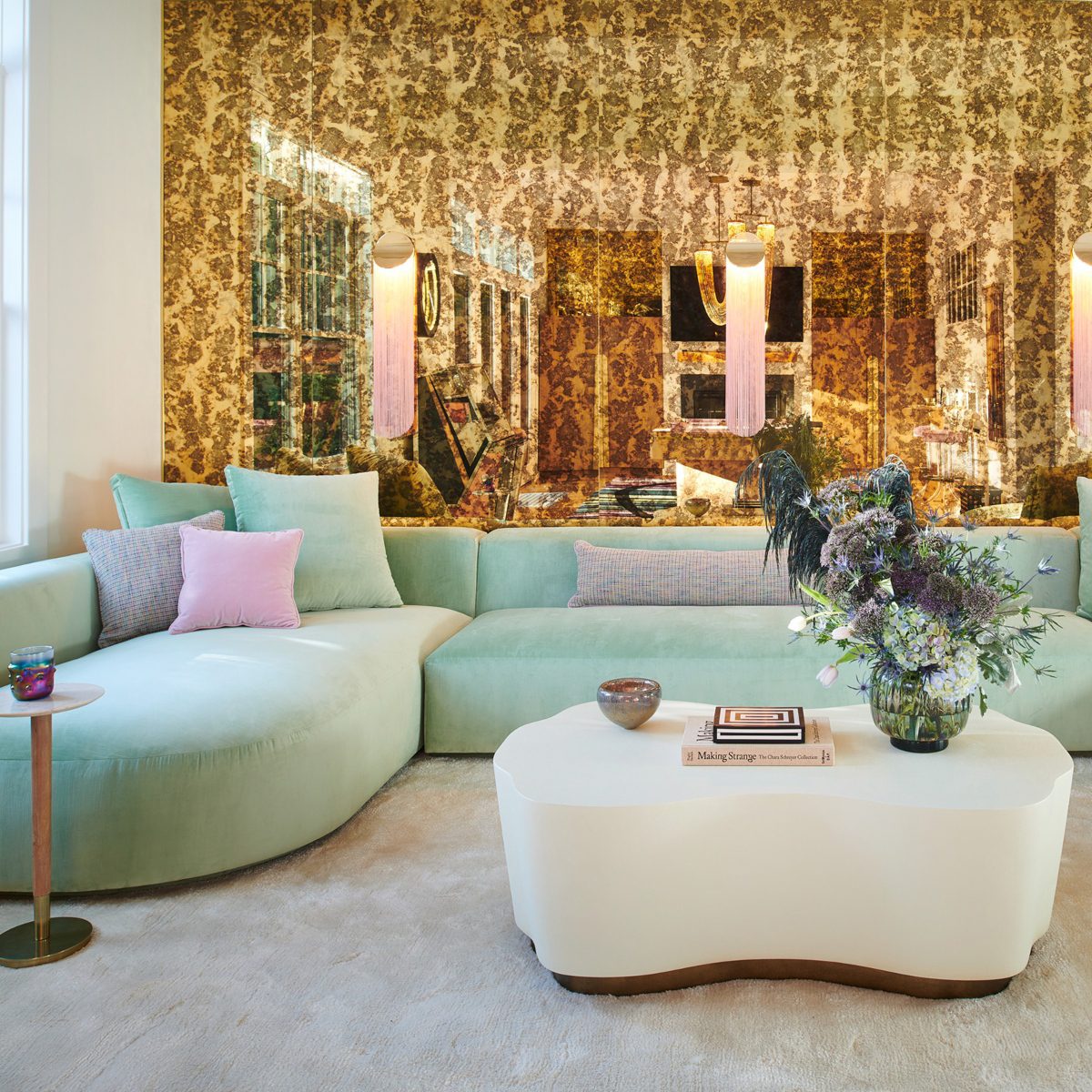 Living Room at J.Fisher Interiors Project Living room with a sofa in mint green tones and a white coffee table.