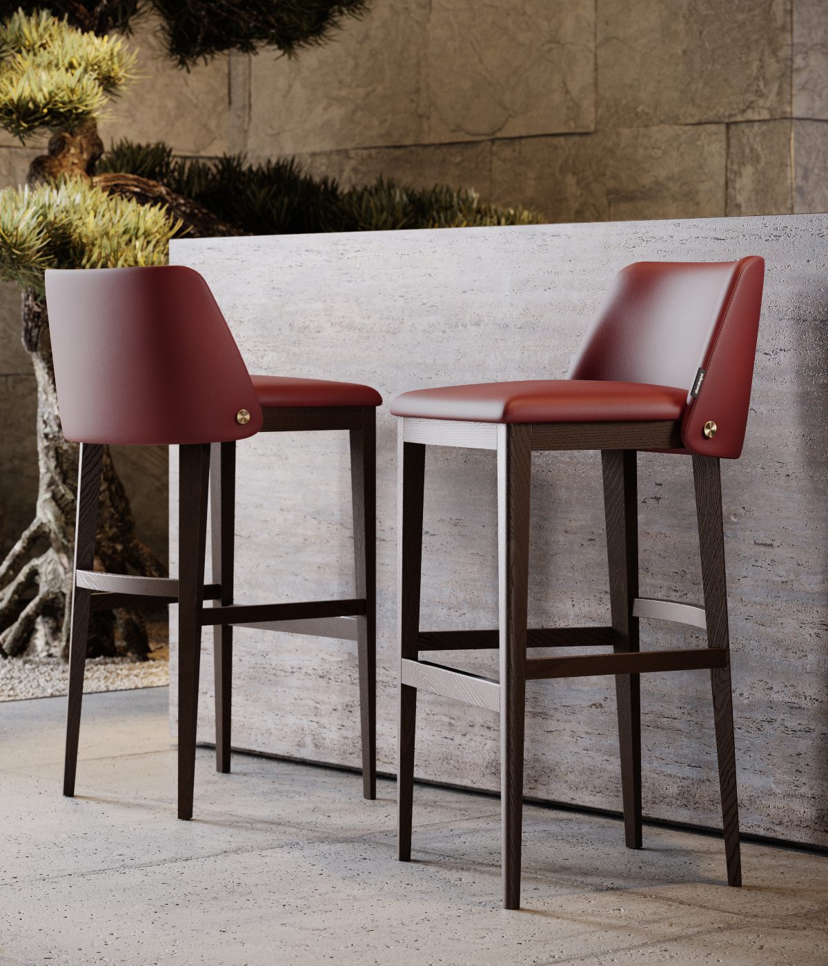 Louise bar chair 2022 lookbook A pair of vibrant red bar stools set against a minimalist concrete wall, enhancing the contemporary decor.