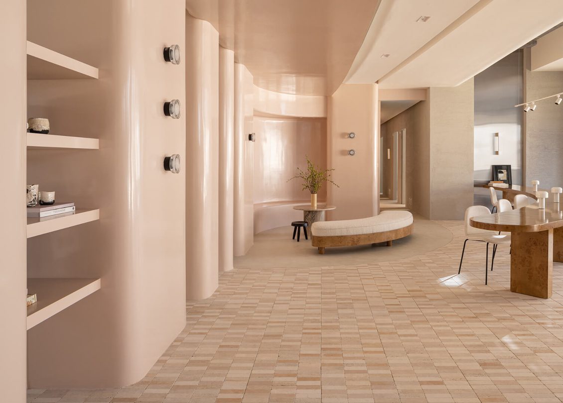 Nebras Aljoaib Creative Studio Spa design by Nebras Aljoaib Creative Studio. Walls in light pink tones and furniture in neutrals. Very clean design with a waiting space with a bench.