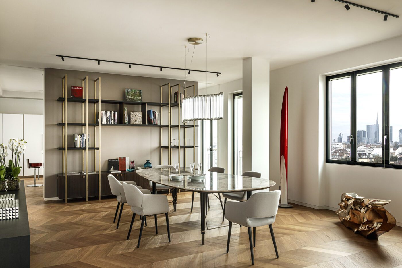 Pelizzari Studio - project (1) Contemporary dining room showcasing a beautiful city view through expansive windows, filled with natural light. By Pelizzari Studio, one of the best italian interior designers.