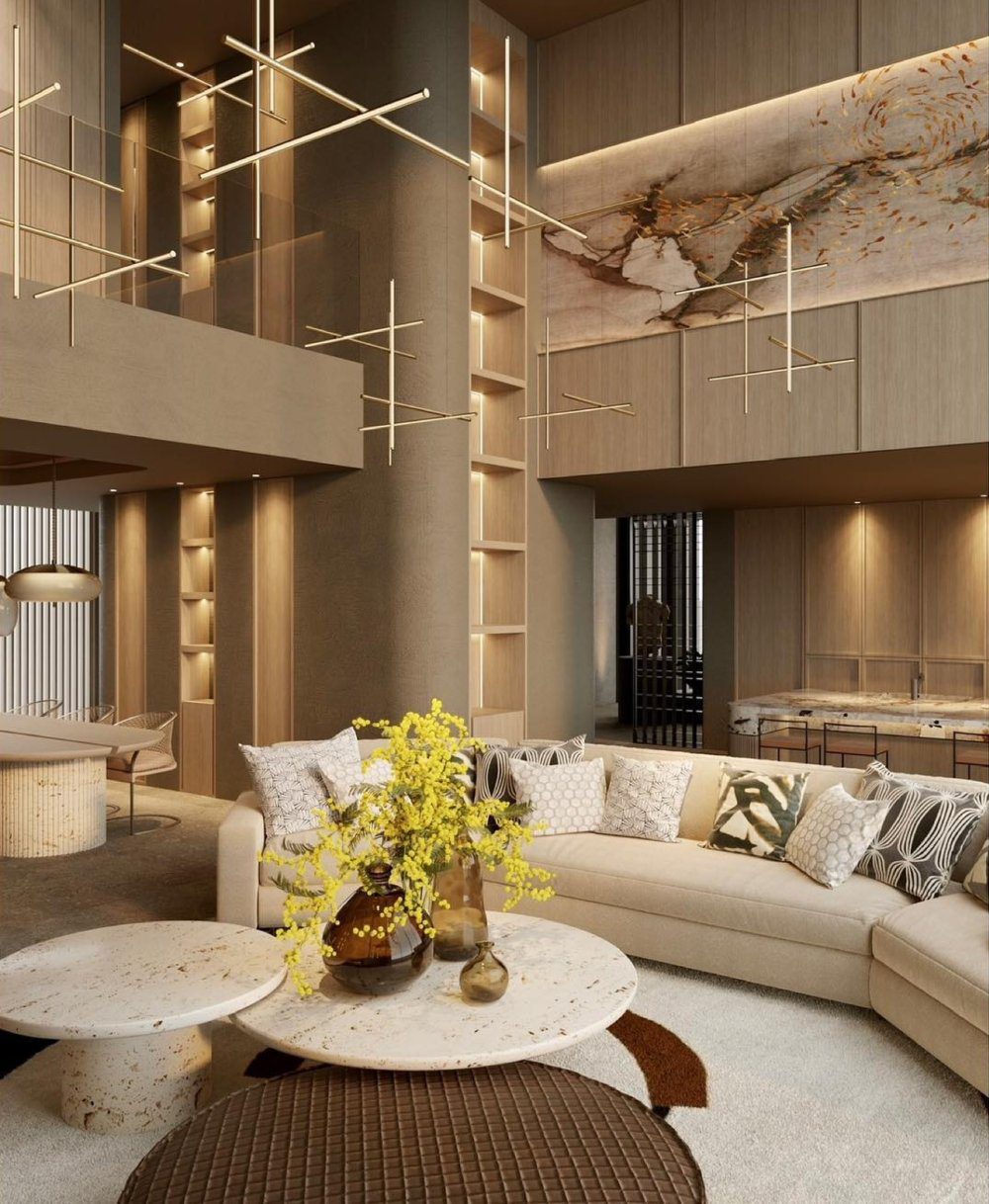 Project by JA Flores Living project in Spain by JA Flores. All in neutrals and with gold and marble accents. The sofa is bege and the coffee tables are in marble. The lighting is simple and golden.