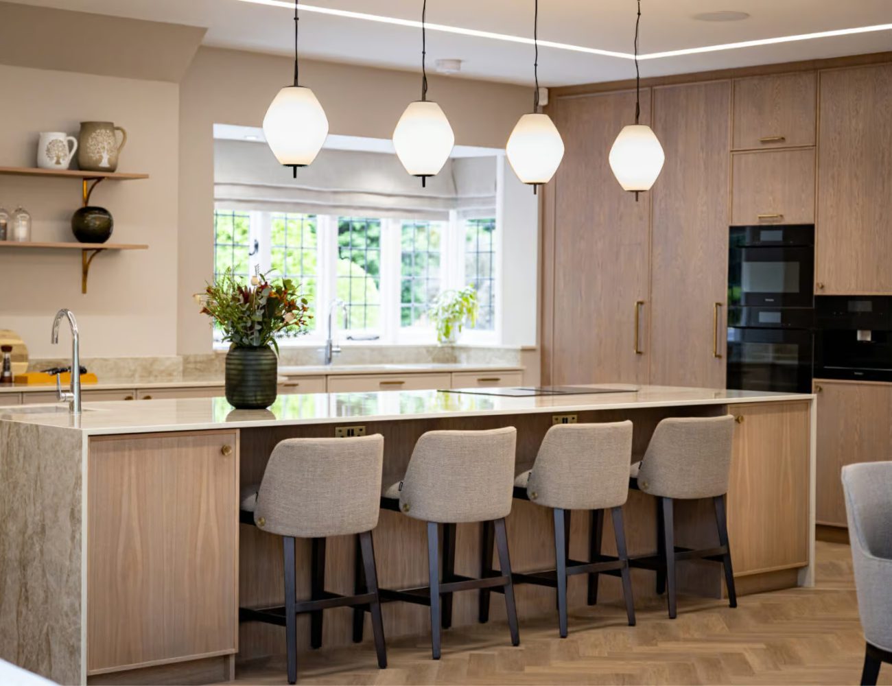 Rossi Studio Kitchen Design Modern kitchen by Rossi Studio showcasing a large island with counter chairs, creating a welcoming space for cooking and socialising.
