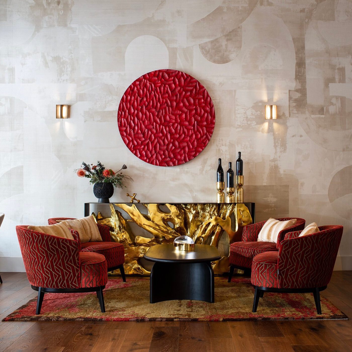 Shawback Design project modern interior with four armchairs in a red fabric with gold accents.