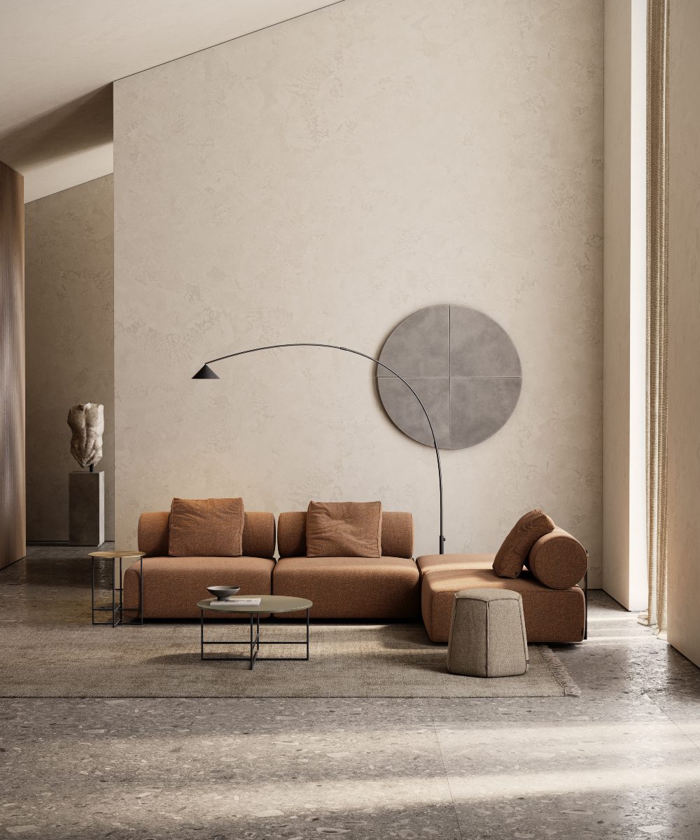 Shinto modular sofa in boucle A contemporary living room showcasing a big round light, adding a warm glow to the sleek furniture and decor. The modular sofa perfect aligns with the 2025 interior design trends