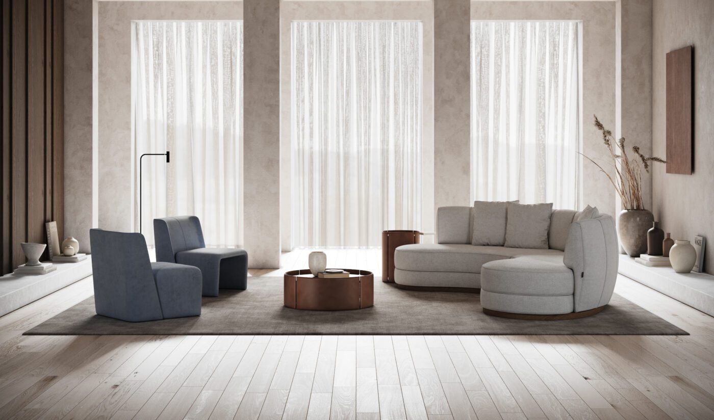 Stella sofa and Legacy armchair living room A modern living room with a curved sofa, an armchair in blue tones and a sleek table, perfect for leisure and entertaining guests. From the best furniture colours and fabrics
