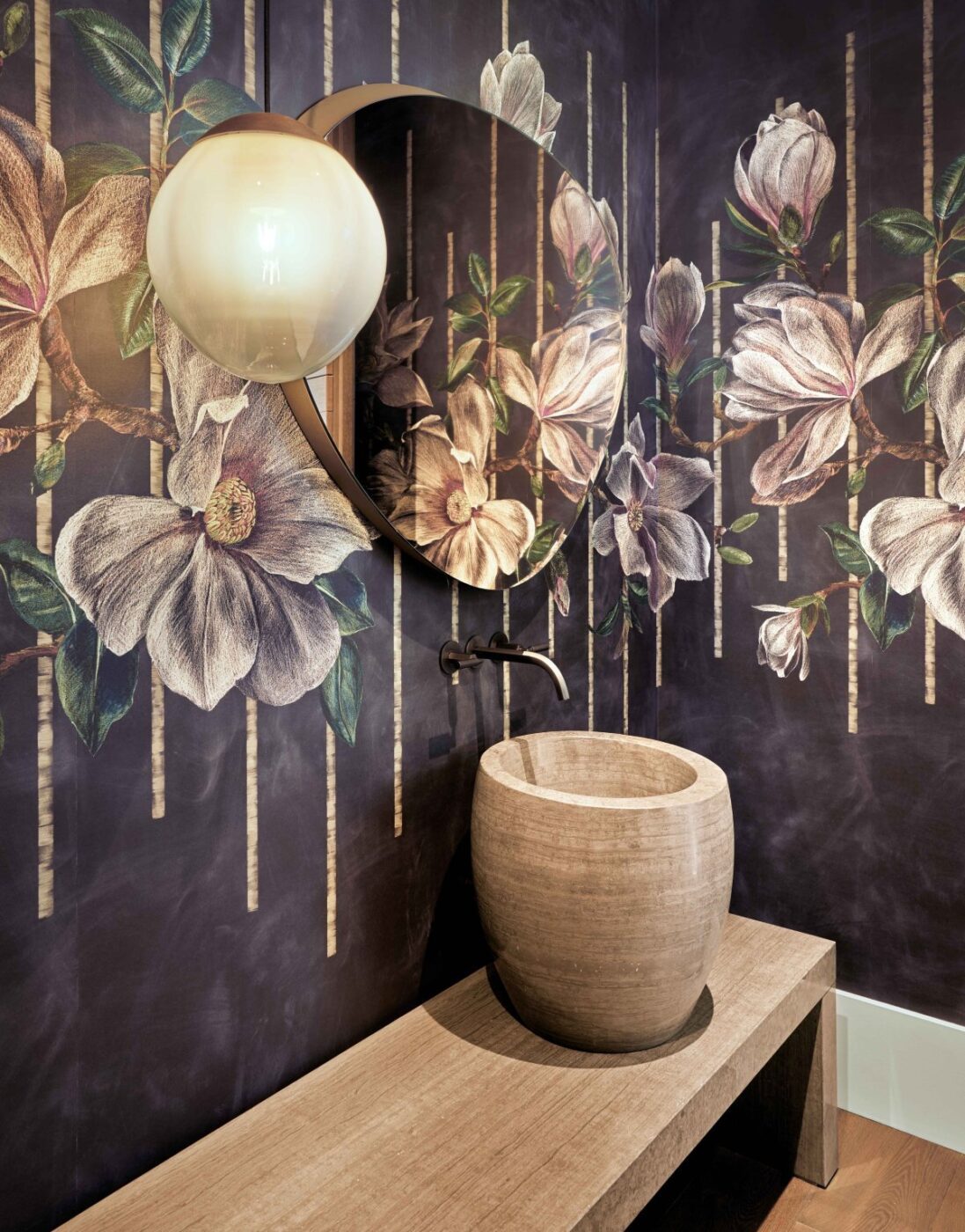 Trilogy Project by Shawback Design Trilogy Project by Shawback Design. Bathroom design with a dark wall with flowers and stone ornaments.