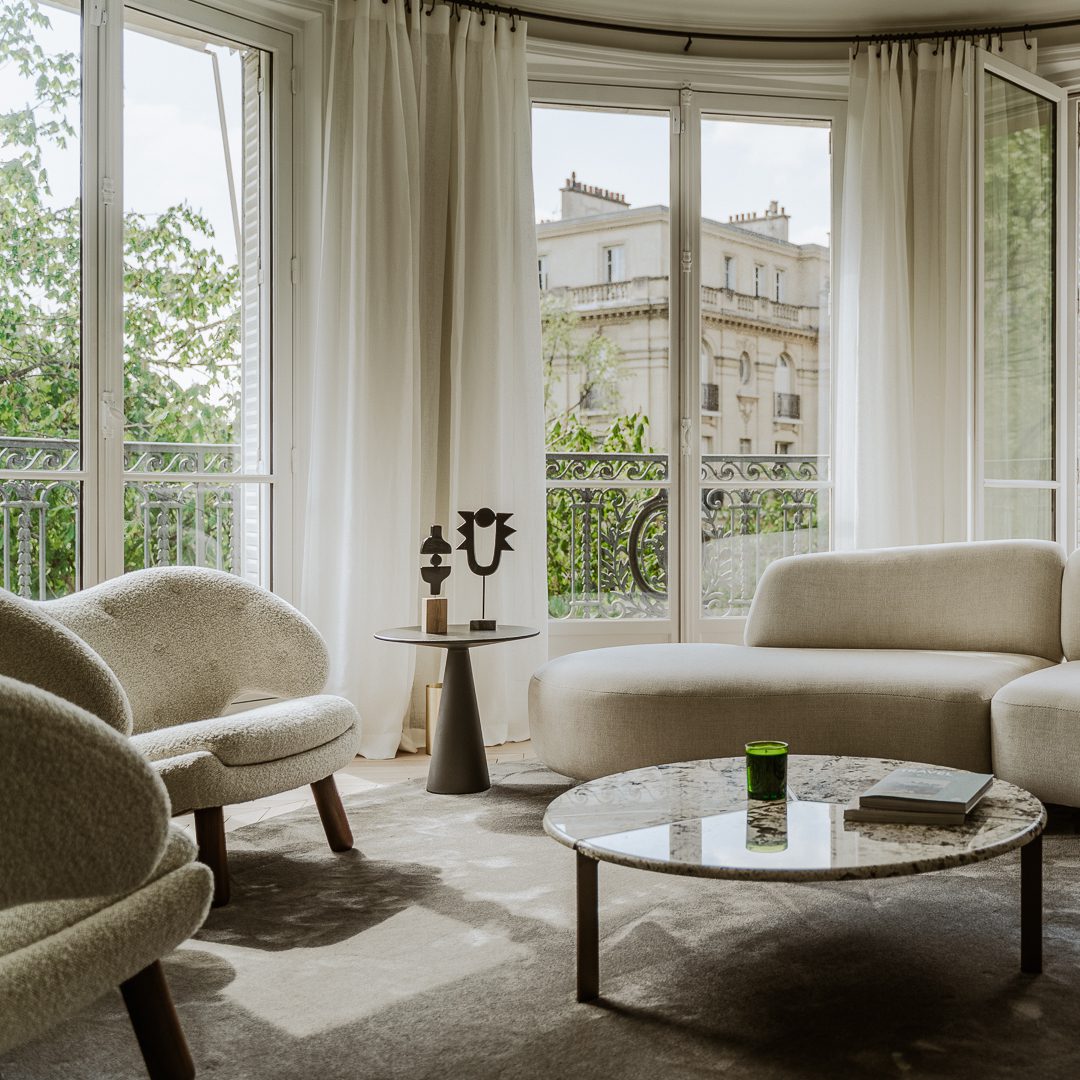 Véronique Cotrel Agency project (1) Living room project with neutral tones and views to the eiffel tower