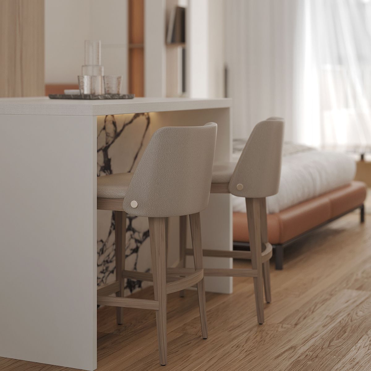 White home project in Slovakia (6) Modern room with light wood flooring, featuring a sleek white kitchen island with two beige upholstered bar stools. A plush bed is in the background.