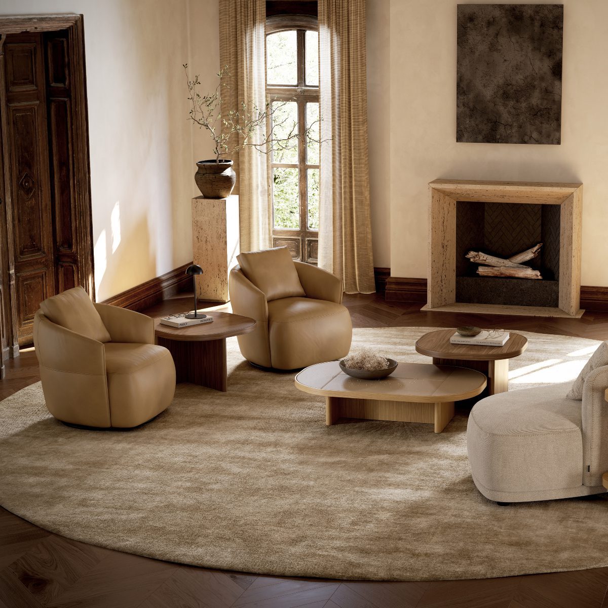 alice armchairs in a living room with gilbert table set A stylish living room with a round rug at the centre and comfortable armchairs surrounding it. With gilbert table set in the centre and next to the armchairs.