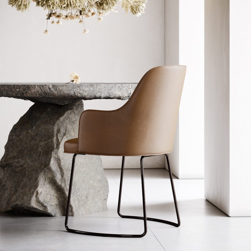 A chair is placed on a stone table, highlighting an unconventional use of space and design.