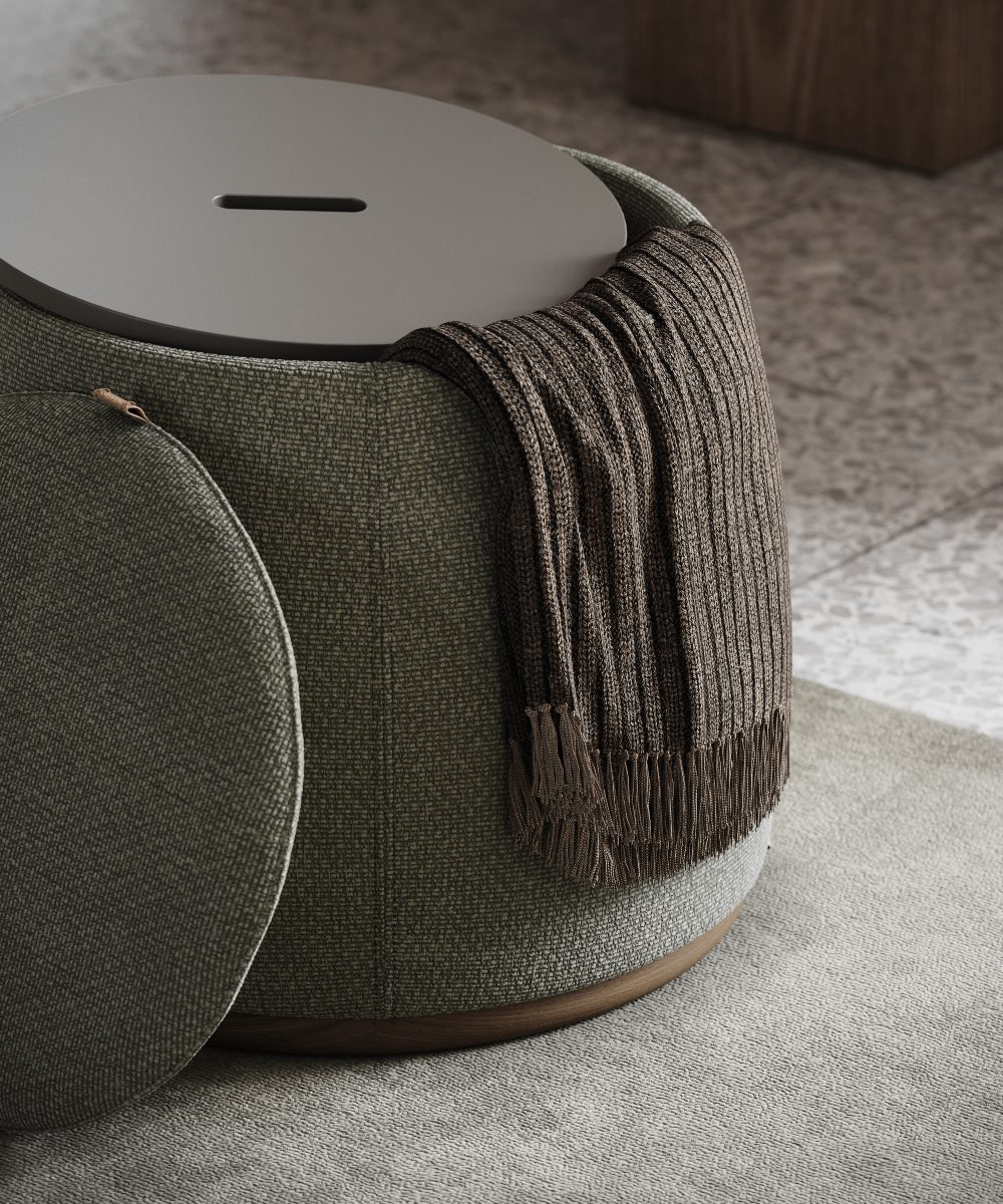 avery pouf open A round pouf with a soft blanket draped over it. Perfect for hidden storage in a social space design.