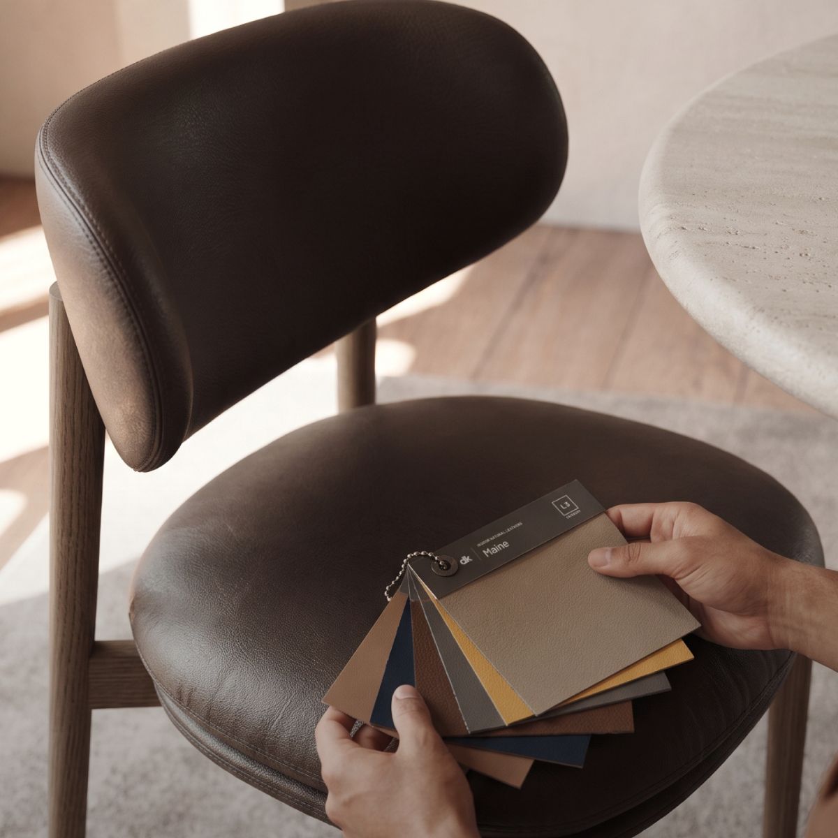 blog article about ordering furniture online by domkapa (5) A person reviews a colour swatch, considering options for an upcoming creative project.