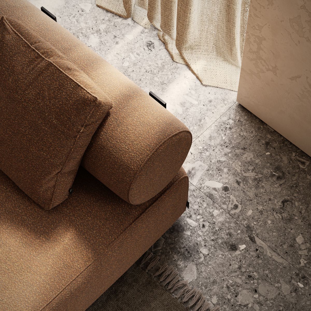 blog article about upholstery finishes by domkapa (9) A comfortable modular sofa with a plush pillow, enhancing the aesthetic appeal of the living area.