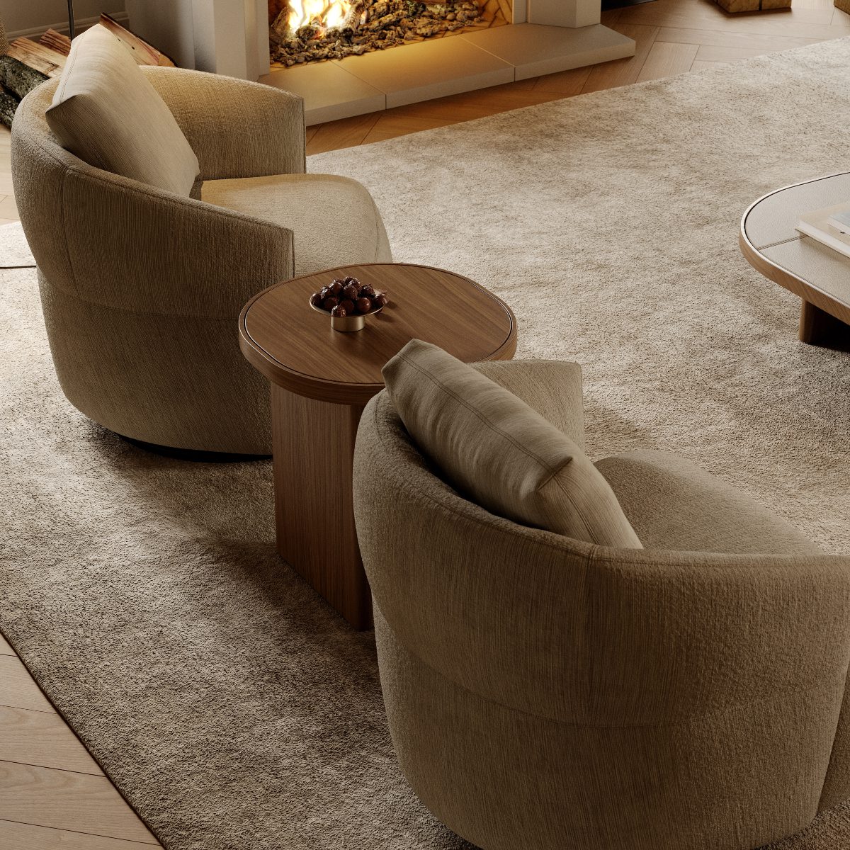 corner with alice armchairs and gilbert A warm living room scene with a fireplace and two inviting chairs positioned nearby. Café core