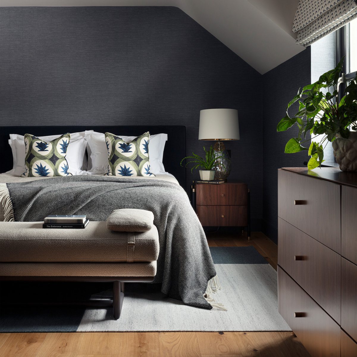 edit design studio with our henry bench A contemporary bedroom showcasing dark walls and a well-arranged bed and a bench, offering a tranquil and inviting space. Designed by Edit Design Studio.