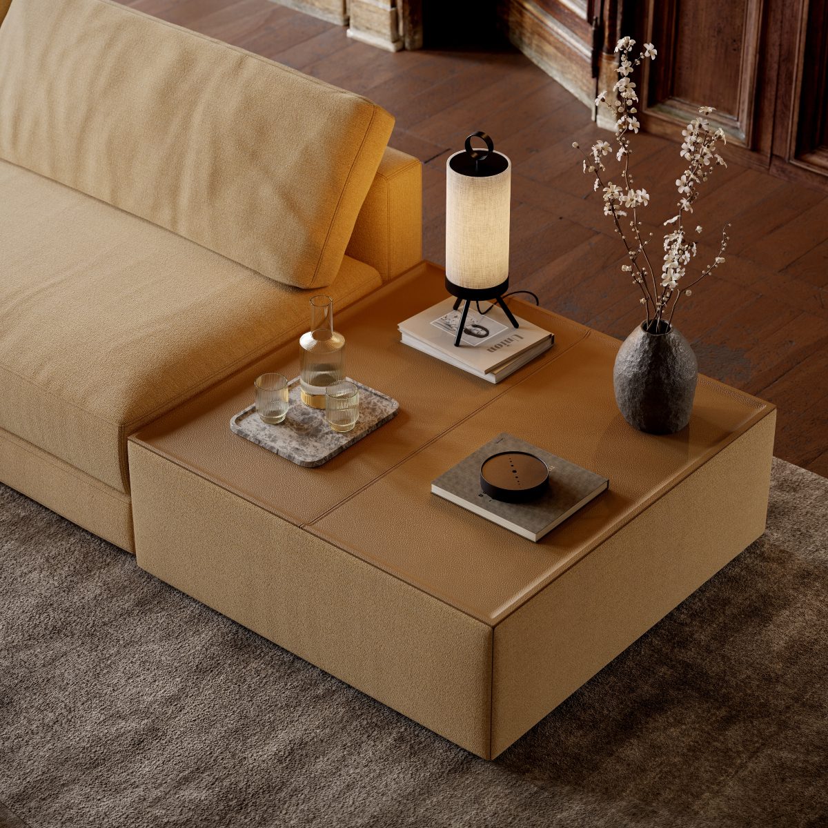 A modern modular sofa with a side table and lamp on it, enhancing the room's comfort and ambiance.