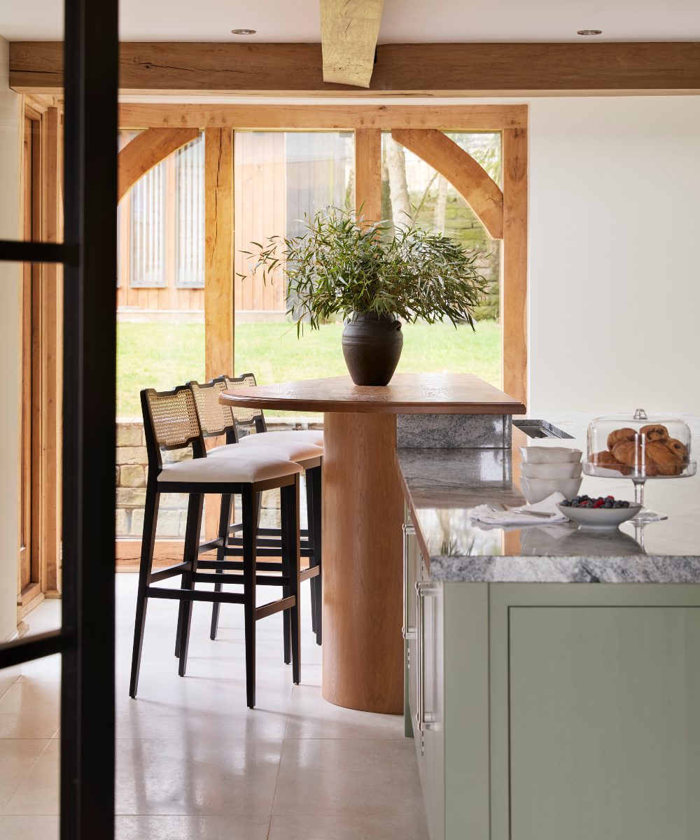 eva bar chair in a bar project Inviting kitchen scene, a modern heritage home, showcasing a table with bar chairs, perfect for family gatherings.
