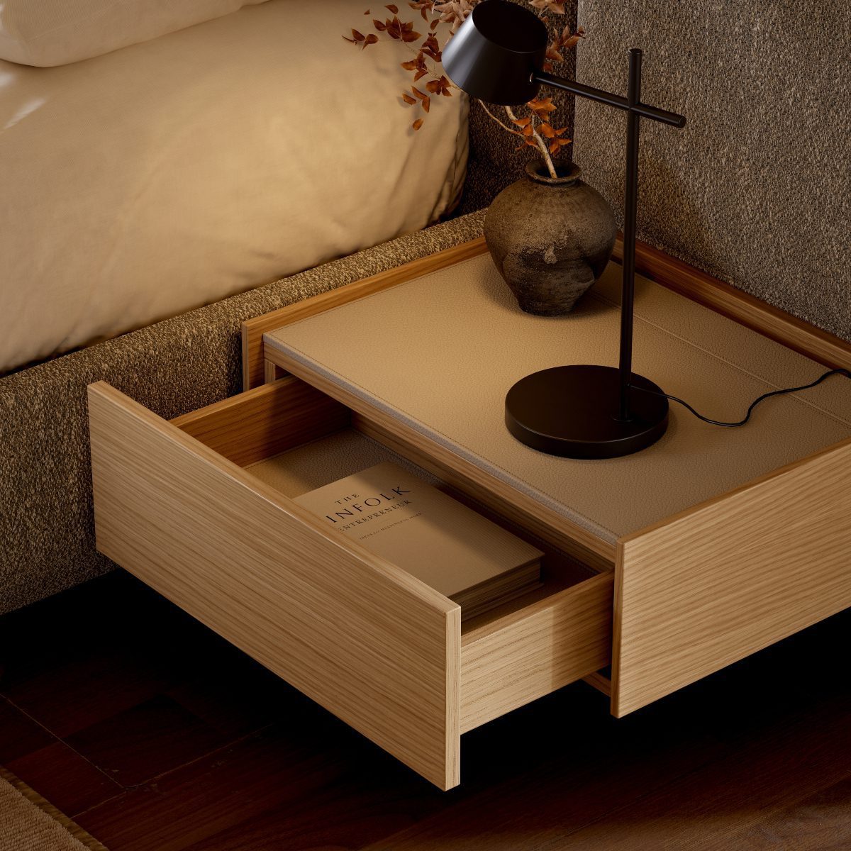 francis bedside table in wood A bedside table adorned with a lamp and a book, inviting a peaceful atmosphere for bedtime stories.