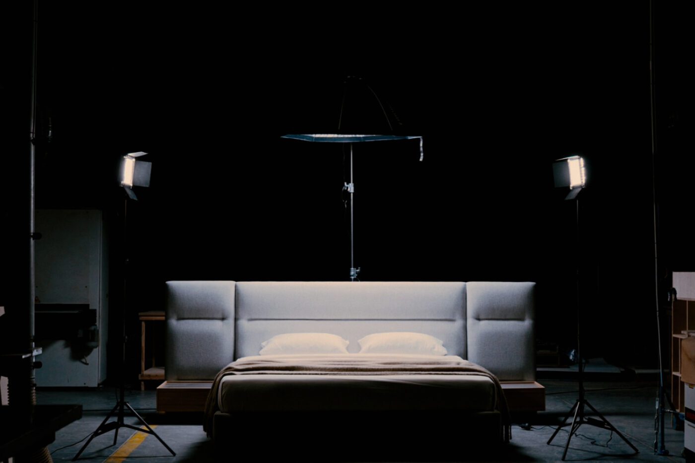 francis modular bed black friday A bed adorned with a gentle light and a camera positioned on top, suggesting a creative space. Black Friday 2025
