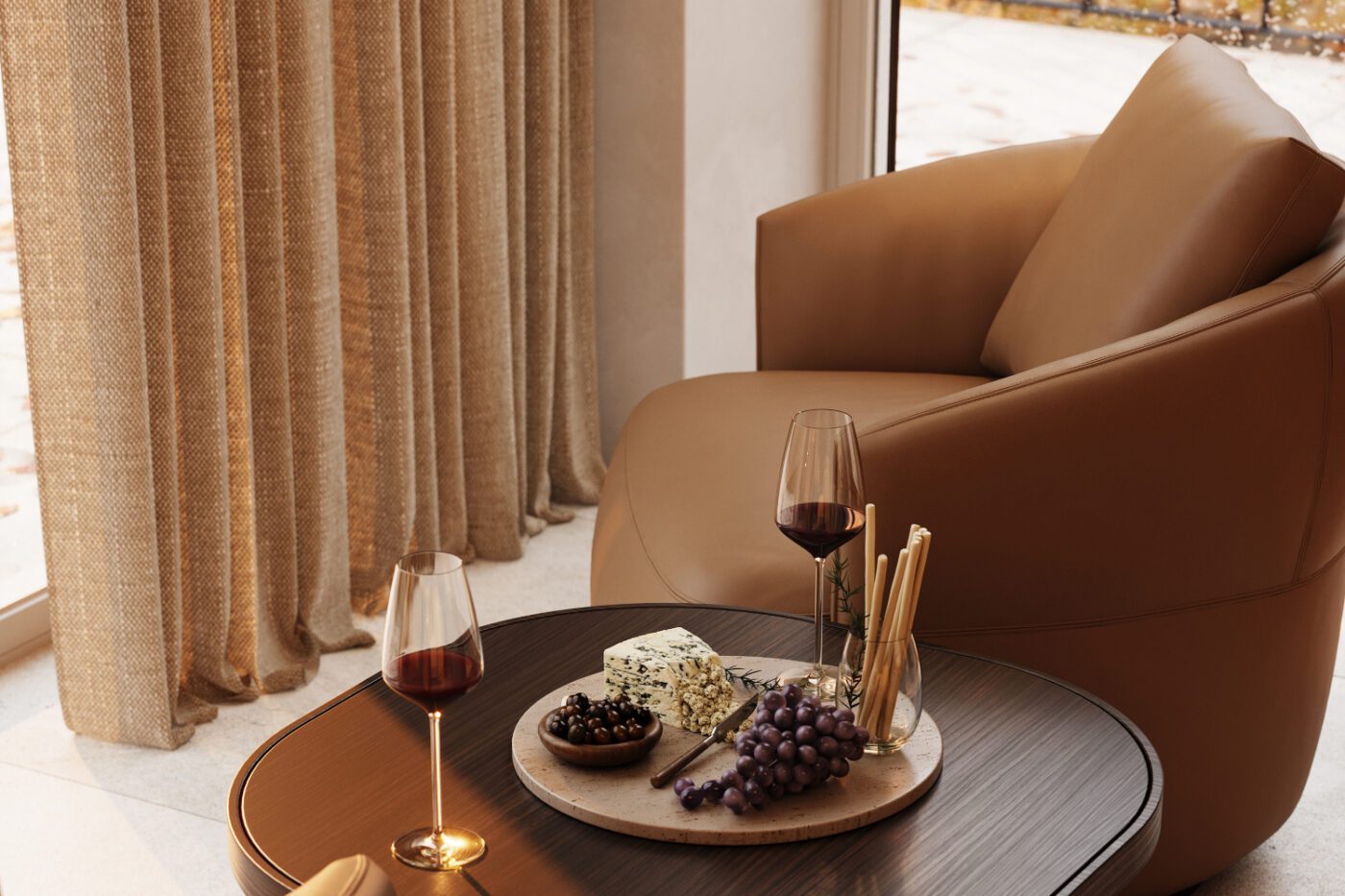 A comfortable armchair featuring a glass of wine and a plate of cheese, suggesting a moment of indulgence and tranquility. Autumn Trends